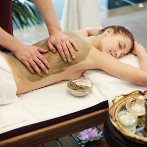 woman-enjoying-mud-massage-in-spa.jpg